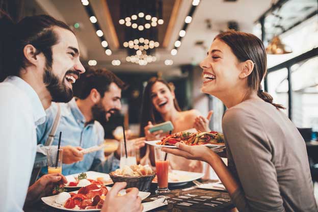 A group of diners are enjoying their meal in an Eureka Springs restaurant.