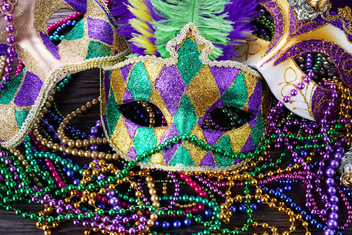 Mardi Gras mask and beads.