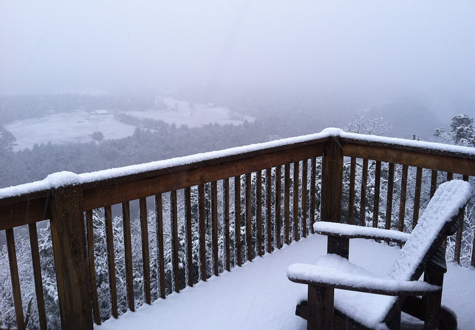 Snow covered deck at Can U Canoe Riverview Cabins
